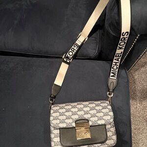 Michael Kors Crossbody, black and gray with a gold locket.